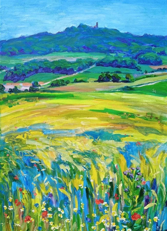 Image of Blick auf den Bussen aus einem blühenden Weizenfeld by Karina Semenyuk, size: 50 x 70, made of Oil on canvas, Paintings medium, from Unlingen, Germany, part of the Summer 2025 series, priced at €380